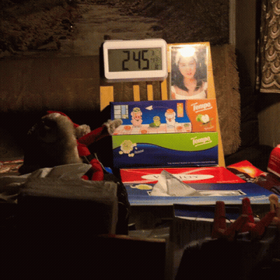 A Box Of Tampa Tissues Sits On A Table Next To A Clock GIF