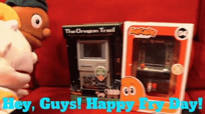 A Box Of The Oregon Trail Sits Next To A Box Of Arcade Games GIF