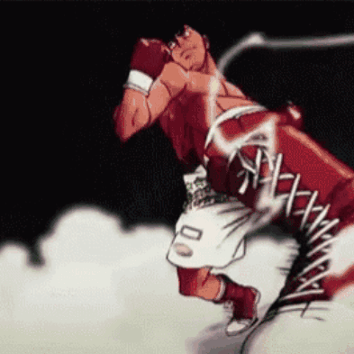 A Boxer With The Number 00 On His Shorts Is Throwing A Punch GIF