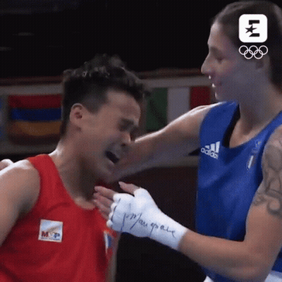 A Boxing Match Between A Man And A Woman With A Logo For The Olympics GIF