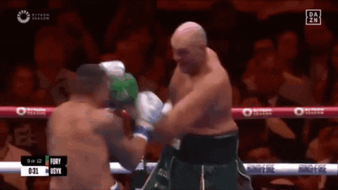 A Boxing Match Between Fury And Syx Is Being Shown GIF