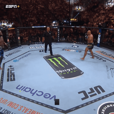 A Boxing Ring With A Monster Energy Advertisement GIF