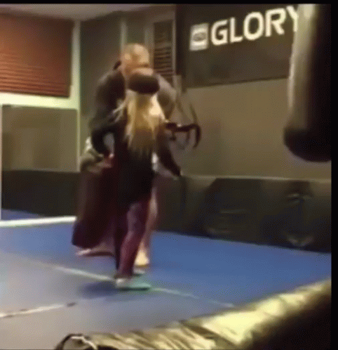 A Boxing Ring With A Sign That Says Glory In The Background GIF