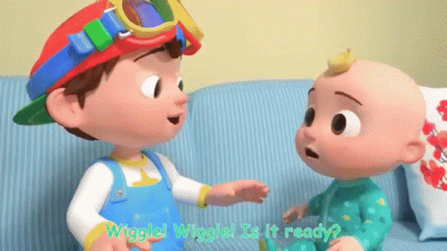 A Boy And A Baby Are Talking To Each Other On A Couch . GIF