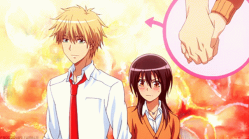A Boy And A Girl Are Holding Hands With A Pink Circle In The Background GIF