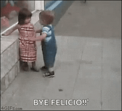 A Boy And A Girl Are Hugging On The Sidewalk . GIF