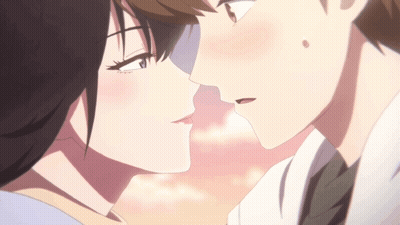 A Boy And A Girl Are Kissing In A Close Up Of Their Faces GIF