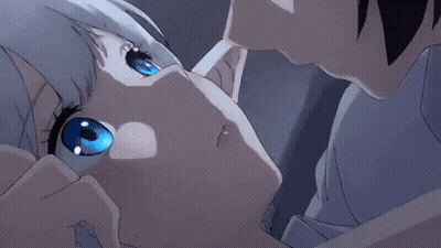 A Boy And A Girl Are Kissing In A Dark Room GIF