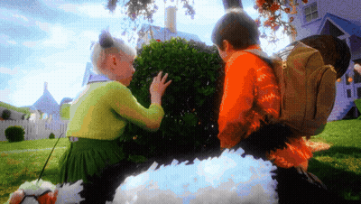 A Boy And A Girl Are Looking At A Bush In A Yard GIF
