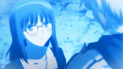 A Boy And A Girl Are Looking At Each Other And The Girl Is Wearing Glasses GIF
