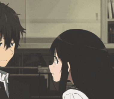 A Boy And A Girl Are Looking At Each Other In A Room GIF