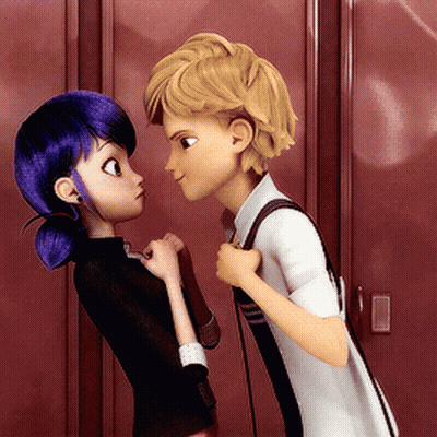 A Boy And A Girl Are Looking At Each Other In Front Of Red Lockers GIF