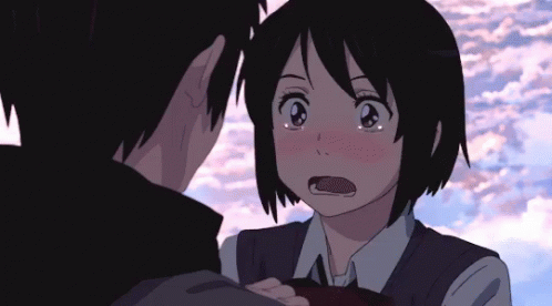 A Boy And A Girl Are Looking Into Each Other 'S Eyes GIF