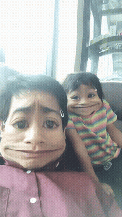 A Boy And A Girl Are Making Funny Faces And The Girl Has A Shirt That Says ' Abercrombie & Fitch ' GIF