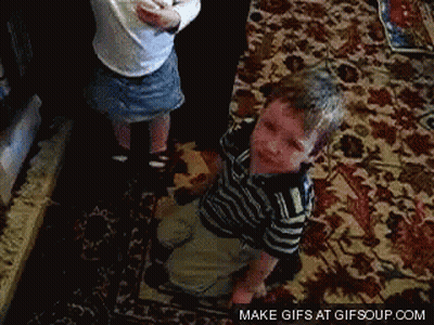 A Boy And A Girl Are Playing On A Rug With The Words Make Gifs At Gifsoup.com GIF