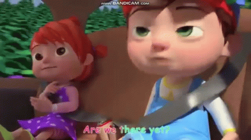 A Boy And A Girl Are Sitting In A Car With The Words Are We There Yet Written On The Screen . GIF