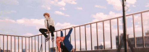 A Boy And A Girl Are Sitting On A Railing On Top Of A Building GIF