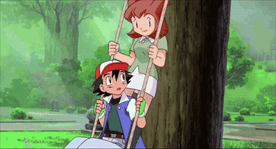 A Boy And A Girl Are Sitting On A Tree Swing . GIF