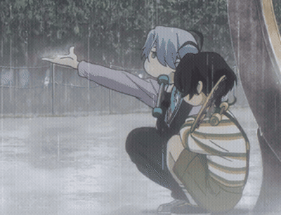 A Boy And A Girl Are Squatting In The Rain And The Girl Is Pointing At Something GIF