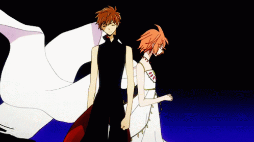 A Boy And A Girl Are Standing Back To Back With Their Eyes Closed GIF