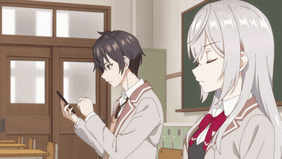 A Boy And A Girl Are Standing In A Classroom Looking At A Cell Phone GIF