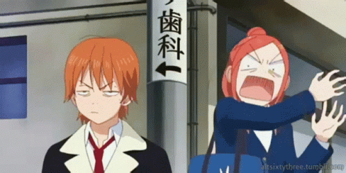 A Boy And A Girl Are Standing In Front Of A Sign That Says ' Dental ' GIF