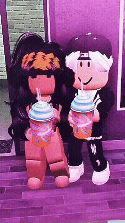 A Boy And A Girl Are Standing Next To Each Other And Holding Drinks GIF
