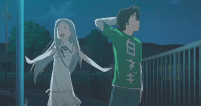 A Boy And A Girl Are Standing Next To Each Other And The Boy Is Wearing A Green Shirt With Chinese Writing On The Back GIF