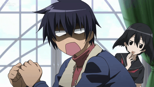 A Boy And A Girl Are Standing Next To Each Other And The Girl Is Licking Her Lips GIF