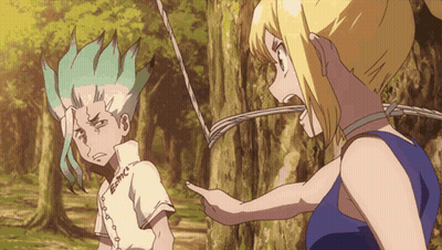 A Boy And A Girl Are Standing Next To Each Other And The Girl Is Pointing GIF