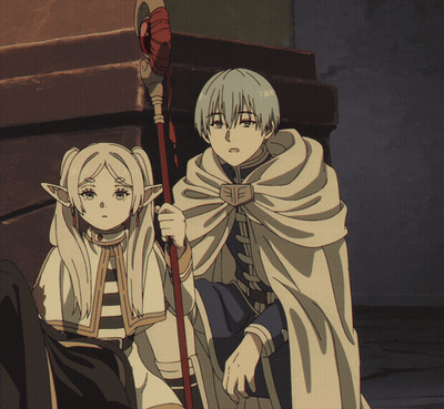 A Boy And A Girl Are Standing Next To Each Other In A Dark Room GIF