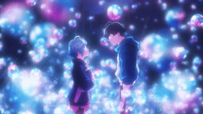 A Boy And A Girl Are Standing Next To Each Other In Front Of Bubbles GIF