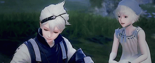 A Boy And A Girl Are Standing Next To Each Other In The Grass GIF