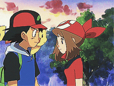 A Boy And A Girl Are Standing Next To Each Other Looking At Each Other GIF