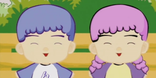 A Boy And A Girl Are Standing Next To Each Other Smiling GIF