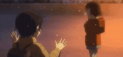 A Boy And A Girl Are Standing Next To Each Other Waving Their Hands In The Air . GIF