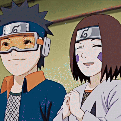 A Boy And A Girl Are Standing Next To Each Other With The Girl Wearing A Headband With A G On It GIF