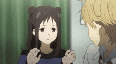 A Boy And A Girl Are Talking To Each Other In A Room . The Girl Is Looking At The Boy . GIF