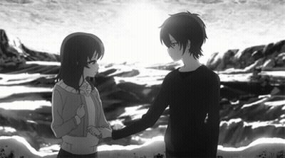 A Boy And A Girl Shaking Hands In Front Of The Ocean GIF