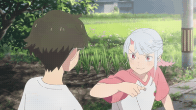 A Boy And A Girl Standing Next To Each Other GIF