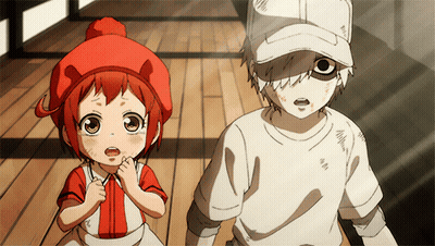 A Boy And A Girl Standing Next To Each Other GIF
