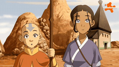 A Boy And A Girl Standing Next To Each Other With A Nickelodeon Logo Behind Them GIF