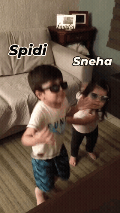 A Boy And A Girl Wearing Sunglasses Are Dancing In Front Of A Couch With The Name Spidi And Sneha Written On Them GIF