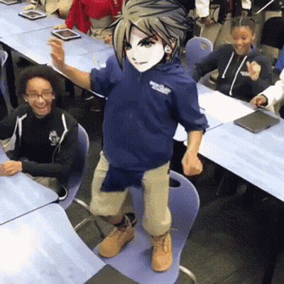 A Boy In A Blue Hoodie Is Standing On A Chair In Front Of A Classroom Full Of Children . GIF