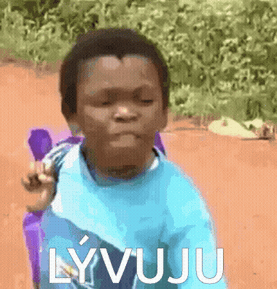 A Boy In A Blue Shirt With The Word Lyvuju Written On It GIF