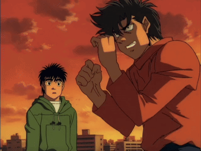A Boy In A Green Hoodie Stands Next To A Man In A Red Shirt GIF