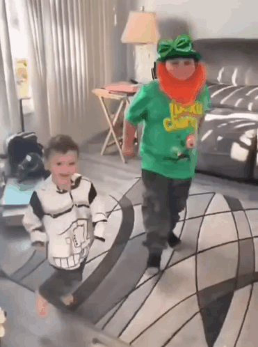 A Boy In A Green Shirt That Says Lucky Charms On It GIF