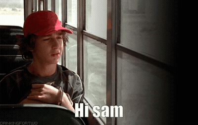 A Boy In A Red Hat Is Sitting On A Bus With The Words Hi Sam Below Him GIF