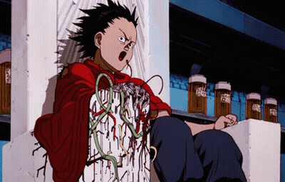 A Boy In A Red Shirt Is Sitting On A Shelf With A Few Bottles Of Beer In The Background GIF