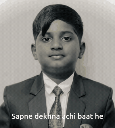 A Boy In A Suit And Tie With The Words Sapne Dekhna Achi Baat He Below Him GIF